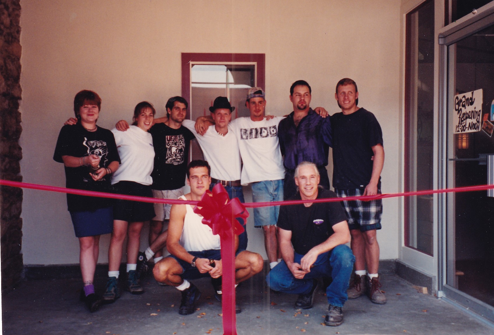 Group of Waxman employees gather together at 609 Mass location for ribbon cutting ceremony.